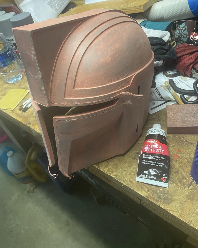 The Architect mando helmet after sanding down the filler.